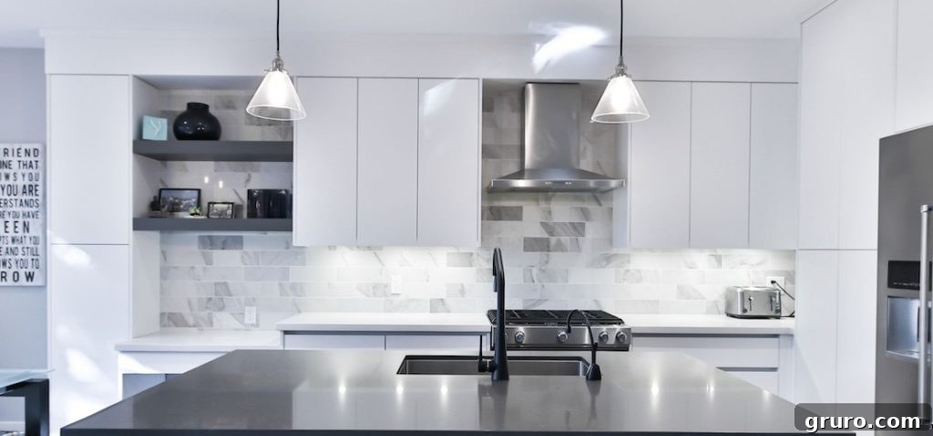 Elevating White Kitchens: 30 Backsplash Inspirations 12 Marble Tile Backsplash for White Cabinets