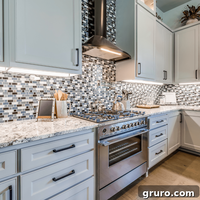 Elevating White Kitchens: 30 Backsplash Inspirations 14 Bold Mosaic Tile Backsplash in White Kitchen