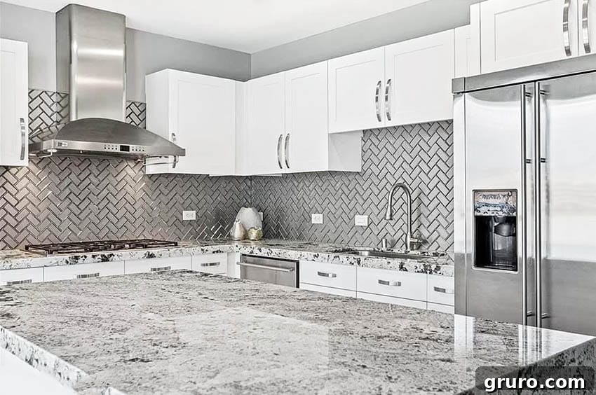 Elevating White Kitchens: 30 Backsplash Inspirations 20 Metal Herringbone Tile Backsplash