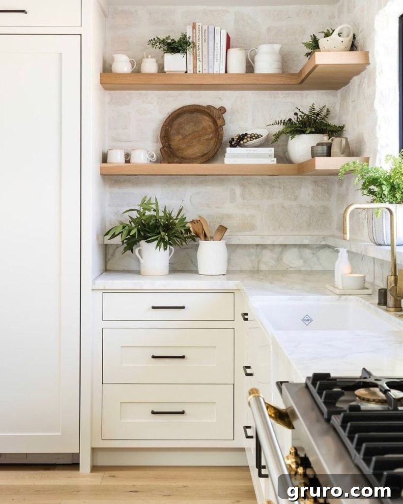 Elevating White Kitchens: 30 Backsplash Inspirations 22 Natural Stone Tile Backsplash for White Cabinets