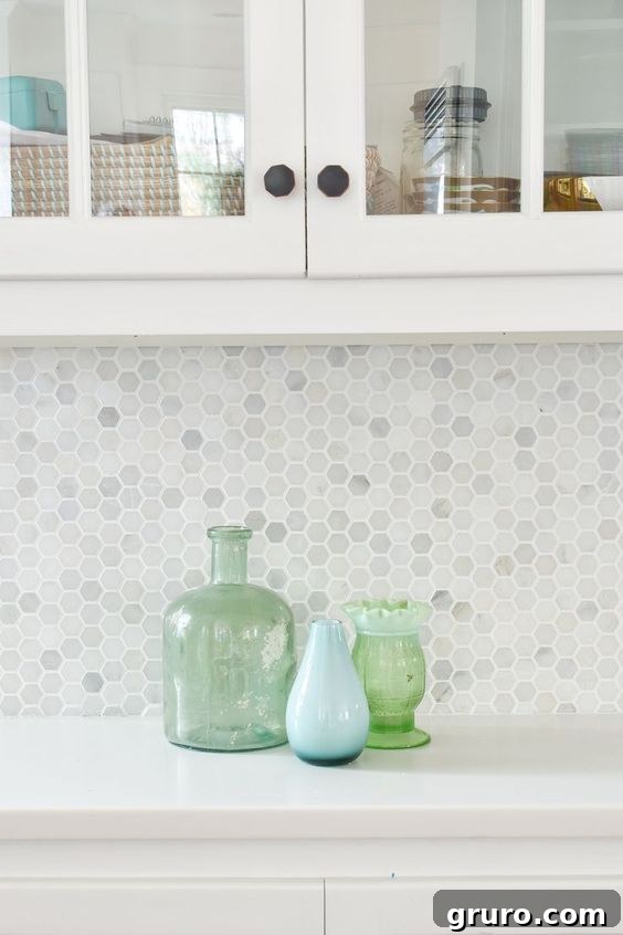 Elevating White Kitchens: 30 Backsplash Inspirations 26 Small Neutral Hexagon Backsplash Idea