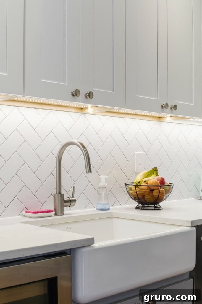Elevating White Kitchens: 30 Backsplash Inspirations 4 Herringbone White Subway Tile White Kitchen Cabinets