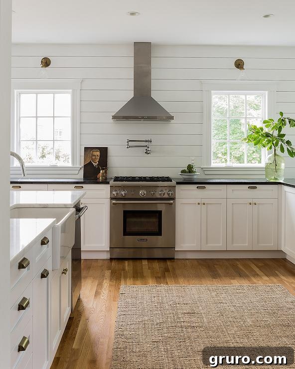 Elevating White Kitchens: 30 Backsplash Inspirations 29 White Shiplap Backsplash for a Modern Farmhouse Kitchen