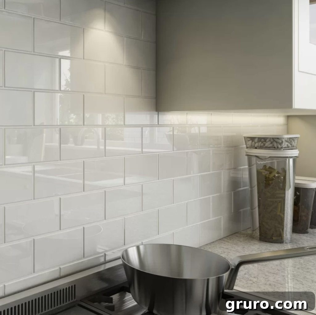 Elevating White Kitchens: 30 Backsplash Inspirations 8 Glass Subway Tile Backsplash in White Kitchen