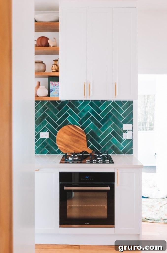 Elevating White Kitchens: 30 Backsplash Inspirations 9 Colorful Herringbone Glass Tile Backsplash