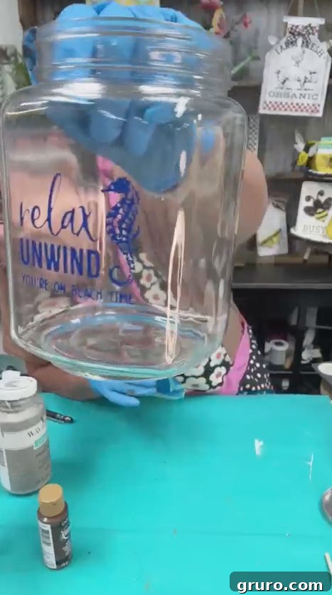 Close-up of a jar with the 'Relax and Unwind' design clearly visible after chalk paste application
