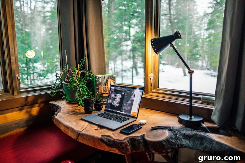 Home office with a clean desk, laptop, and minimalist tech.