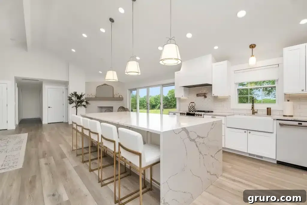 7 Backsplash Ideas to Transform Your White Kitchen 2 White subway tile backsplash with dark grout in a modern white kitchen