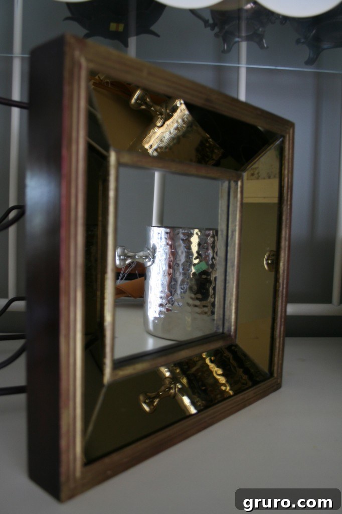 Close-up of a decorative small gold mirror