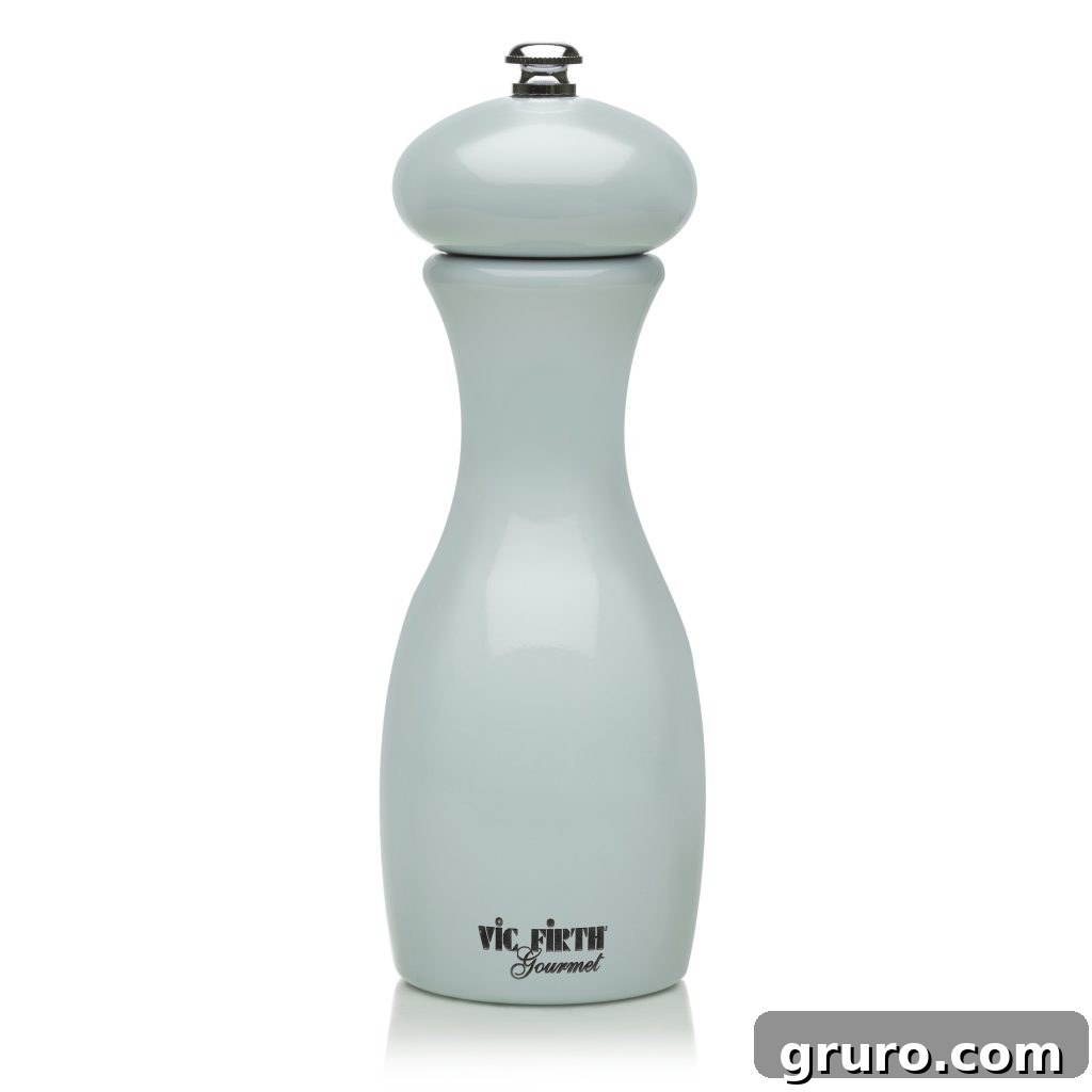 Vic Firth Mario 7-Inch Pepper Mill in a vibrant ocean blue finish, ready for use in a kitchen setting.
