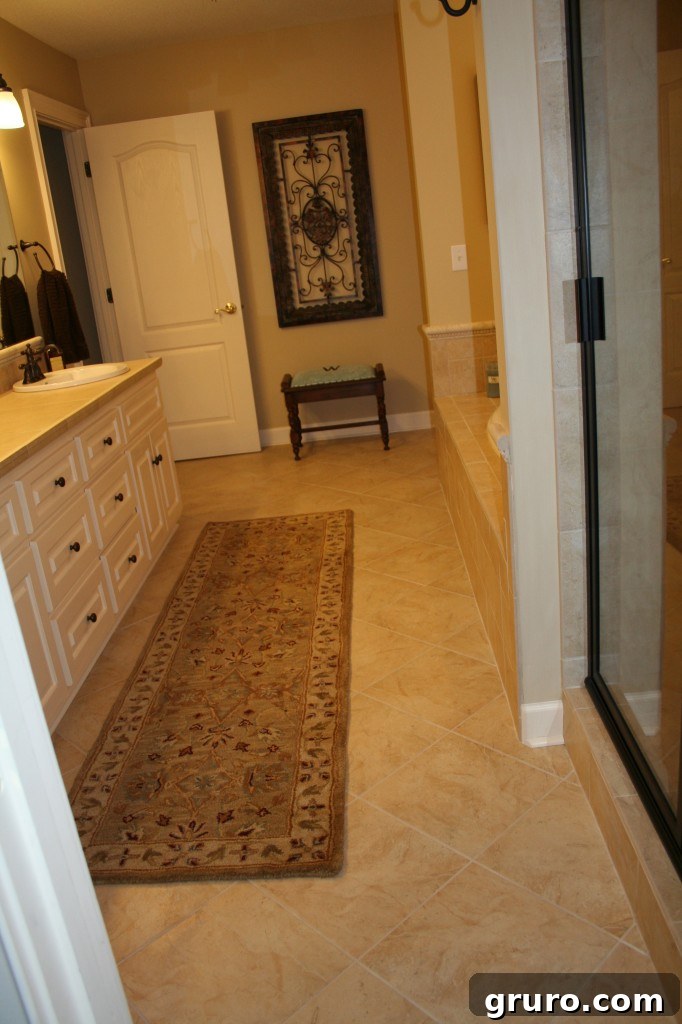 Transformed master bathroom after a major renovation, moving from outdated fixtures to modern elegance and functionality.