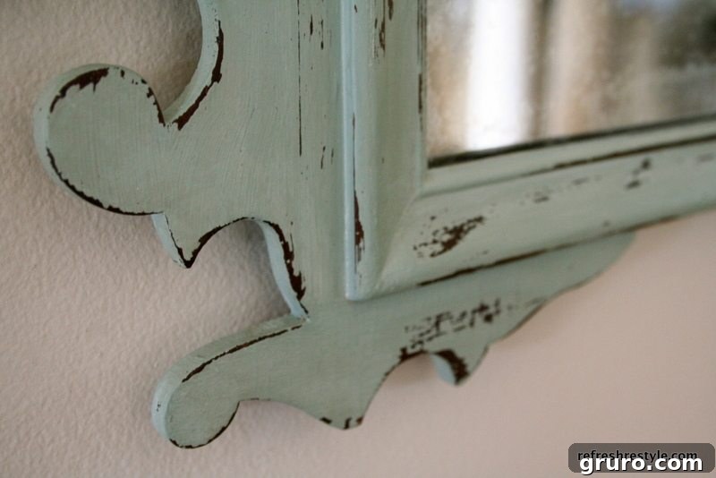 Distressed Mirror Makeover Distressed mirror frame painted with Annie Sloan Duck Egg Blue