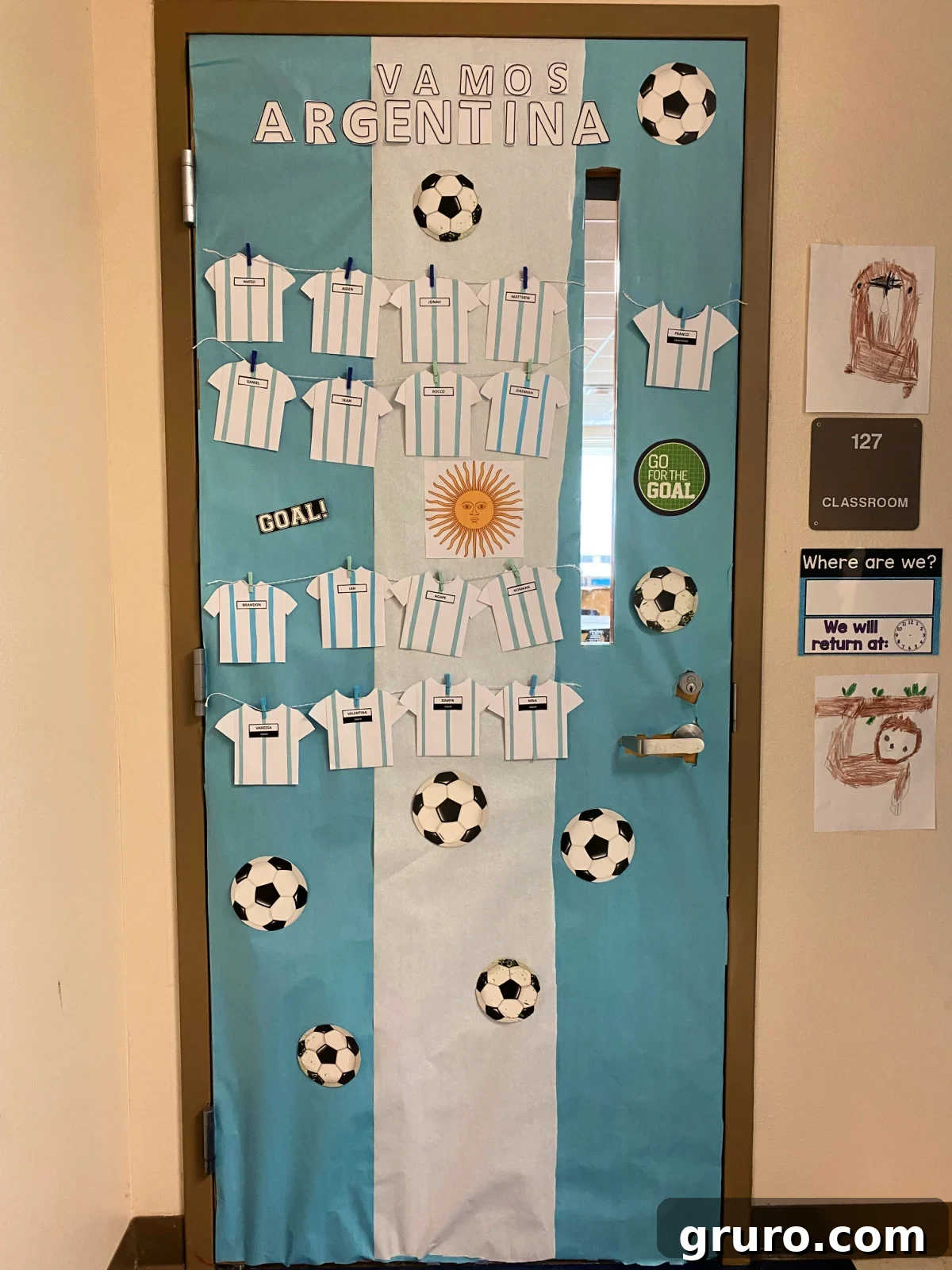 Hispanic Heritage Month Door Decor Ideas 3 Blue and white door that says Vamos Argentina with soccer balls and soccer jerseys.