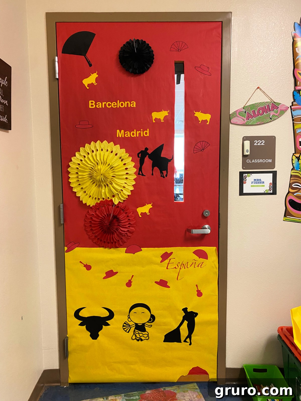 Hispanic Heritage Month Door Decor Ideas 22 Red and yellow door that says 'Barcelona, Madrid, and Espana'.