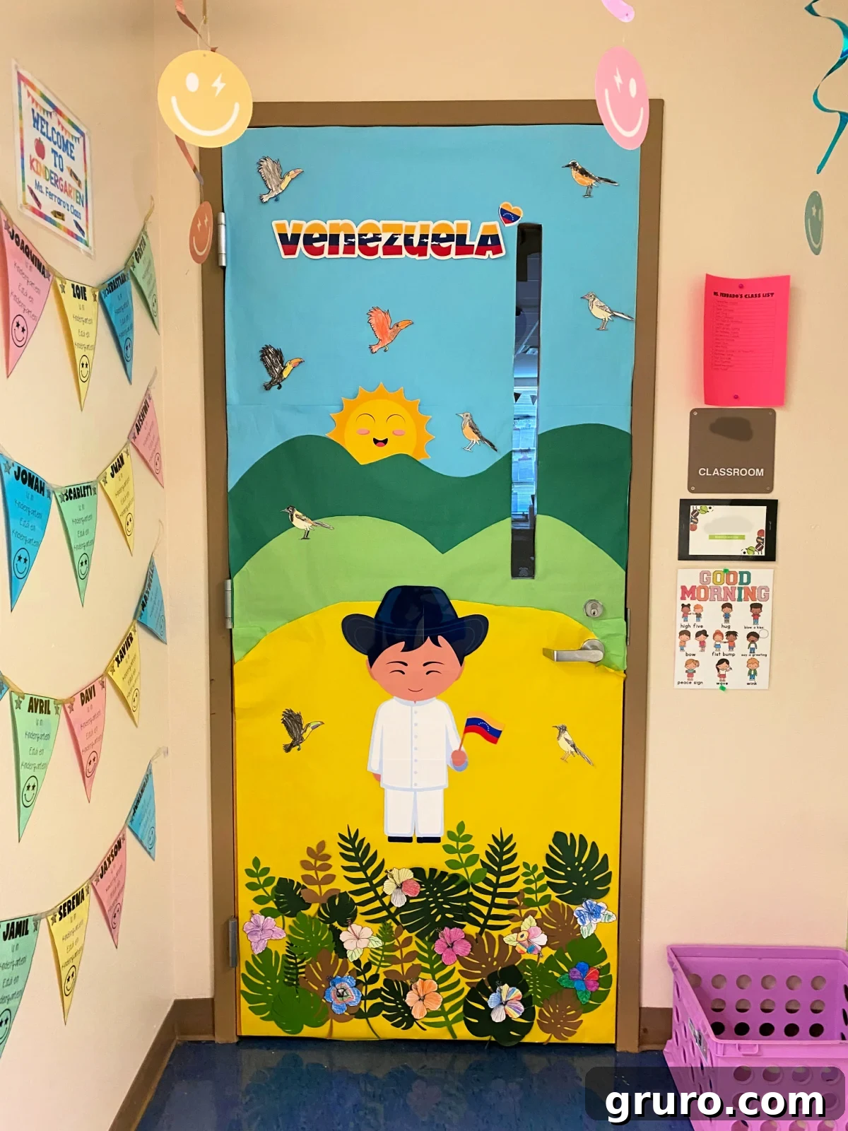 Hispanic Heritage Month Door Decor Ideas 27 Mountainside paper door with a boy holding a Venezuelan flag.